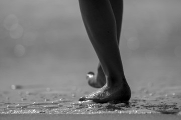 Isolated couple of a kids feet on the water edge of the sea- Israel