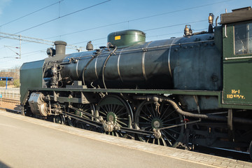 Fototapeta na wymiar Kouvola, Finland - April 18, 2019: Old steam train Ukko-Pekka on the station at morning.