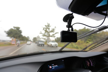 video camera recorder inside car driving rainy day
