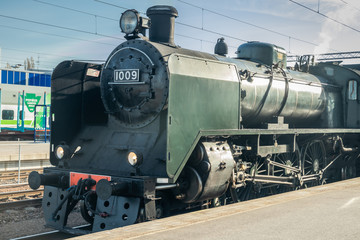 Fototapeta na wymiar Kouvola, Finland - April 18, 2019: Old steam train Ukko-Pekka on the station at morning.