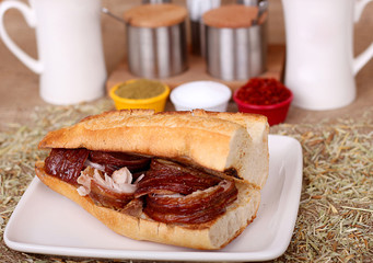 Close up of quarter bread plenty of spicy master kokoreç