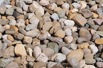 large pebbles in sunshine lying on floor