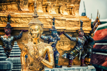 Golden Kinnara Statue at Emerald Buddha temple in Grand Palace of Bangkok
