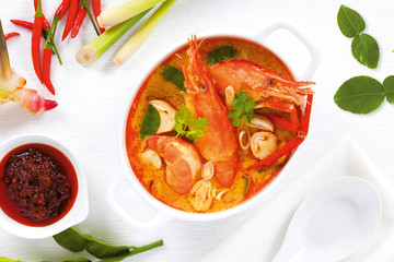 Prawn and lemon grass soup with mushrooms or Tom Yum Kung and Thai ingredient that Thai food cuisine is most popular in Thailand, top view.