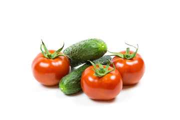 Fresh red tomatoes and cucumbers isolated on white background Food and drink Agriculture