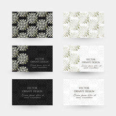 Silver floral elegant motif. Business cards with ornaments on the black and white background.
