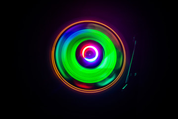 Concept of speed - Trail of fire and smoke - Vinyl record. Burning vinyl disk. Turntable vinyl record player. Retro audio equipment for disc jockey. Sound technology