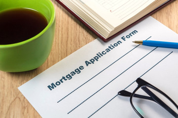 A mortgage application form template to fill out with pen and coffee.