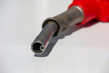 Gasoline pistol pump fuel nozzle Gas station pump. Man refueling gasoline with fuel in a car,...