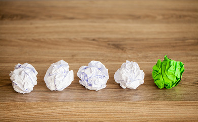 Great idea concept. Crumpled colorful paper on wooden table. Copy space