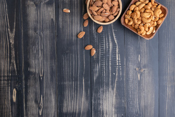 almond and Cashew nut on wooden bowl