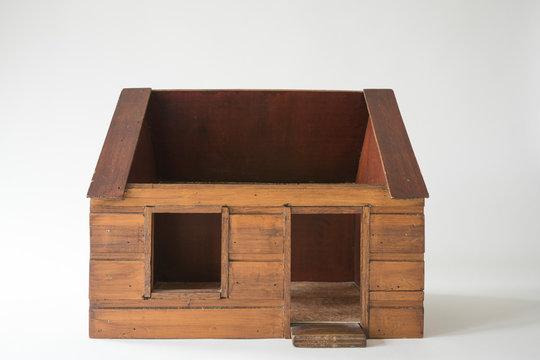 handmade wooden house for toy, against white background