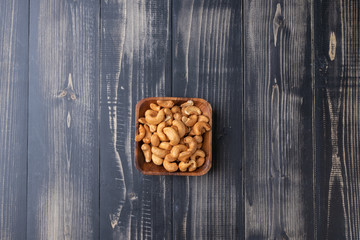 close up of Cashew nut on wooden bowl