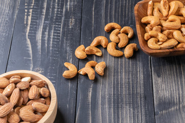 almond and Cashew nut on wooden bowl
