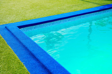 Swimming pool at the edge of the pool is artificial green grass. In the summer and clean water is...