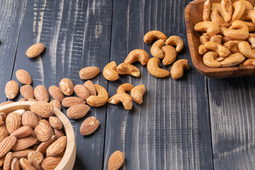 almond and Cashew nut on wooden bowl