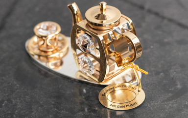 Fototapeta na wymiar Gold Teapot Show Pieces Focus 24k Gold Plated
