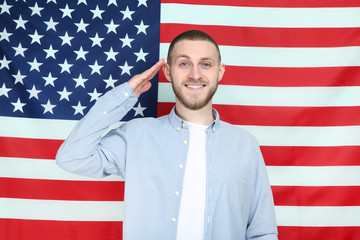 Young man on American flag background