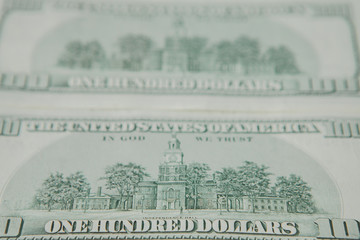 The reverse side of American dollars. Background of dollar bills