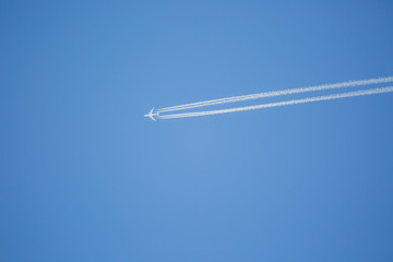 Airplane in the blue sky