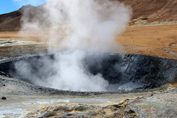 Iceland geothermal zone Namafjall - area in field of Hverir. Landscape which pools of boiling mud and hot springs. Tourist and natural attractions.