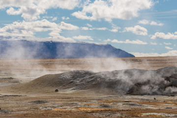 Iceland geothermal zone Namafjall - area in field of Hverir. Landscape which pools of boiling mud and hot springs. Tourist and natural attractions.