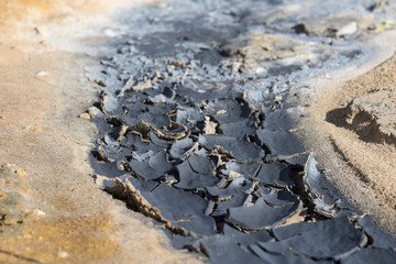 Iceland geothermal zone Namafjall - area in field of Hverir. Landscape which pools of boiling mud and hot springs. Tourist and natural attractions.