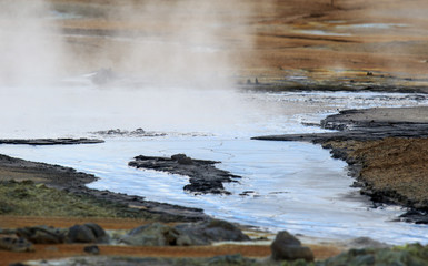 Iceland geothermal zone Namafjall - area in field of Hverir. Landscape which pools of boiling mud and hot springs. Tourist and natural attractions.