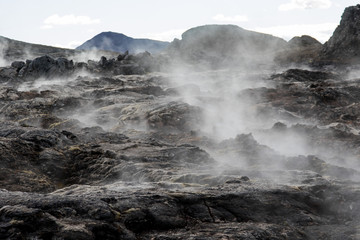 Iceland geothermal zone Namafjall - area in field of Hverir. Landscape which pools of boiling mud and hot springs. Tourist and natural attractions.