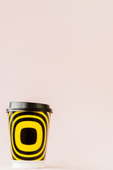 Take-out coffee in thermo cup on a pink background, Copy space
