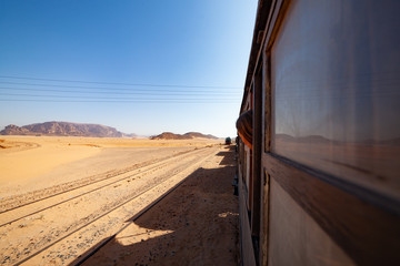 Travel of life. The journey of a lifetime. Most picturesque train road. Traveling by train by desert. Amazing train travel. View behind the window