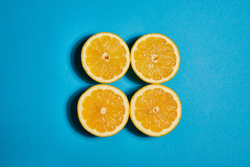 Lemon on blue background. Flat lay, top view, copy space . Food concept.