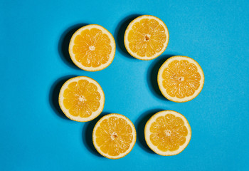 Lemon on blue background. Flat lay, top view, copy space . Food concept.