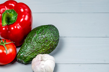 set of ripe vegetables on a white wooden background with a place for copy space