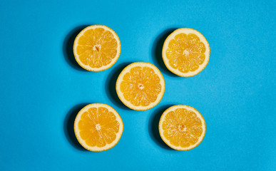Lemon on blue background. Flat lay, top view, copy space . Food concept.