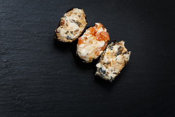 Juicy Gunkan Maki Sushi on black slate