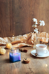 cup of coffee on a wooden background, set in warm brown tones