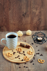 cup of coffee on a wooden background, set in warm brown tones