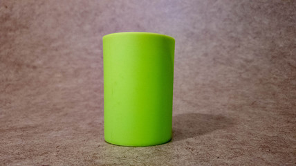 Green glass for drinks in the close-up.