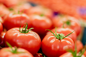 Delicious frash red tomatoes with blurred background
