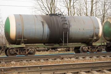 Fototapeta na wymiar Oil transportation train of the tank cargo railroad
