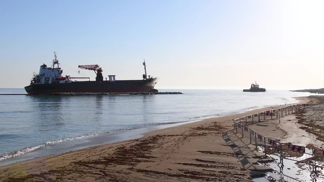 a merchant stuck on a sandy beach on a sunny day