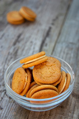 Sandwich, ginger healthy biscuits with cream , close up, isolated. Cookies for tea or snack.