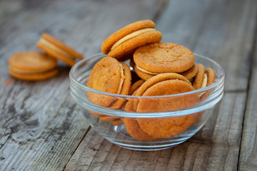 Sandwich, ginger healthy biscuits with cream , close up, isolated. Cookies for tea or snack.