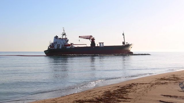 a merchant stuck on a sandy beach on a sunny day