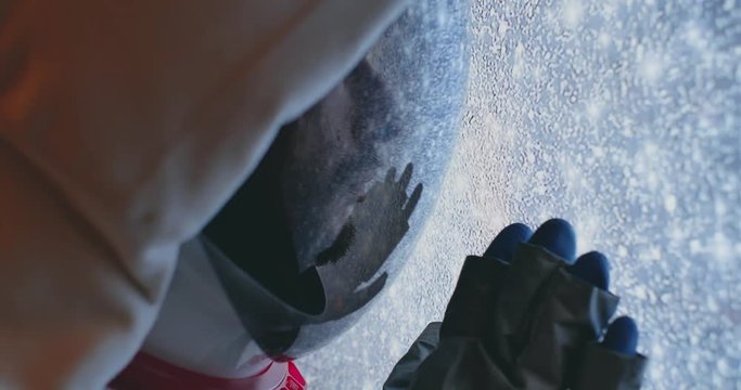 Astronaut exploring the space from his capsule