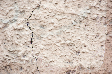 Stone texture of an ancient beige wall