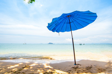 Tropical sea with Blue Umbella on samui beach thailand,summer on the beach