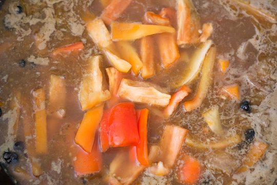 Cook zirvak broth for cooking pilaf meat with rice on fire in the cauldron. Recipe