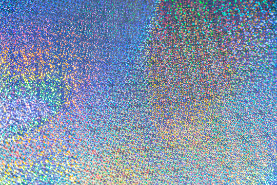 Abstract sparkle holographic texture background. Shiny colorful hologram  paper. Stock Photo by afihermatova